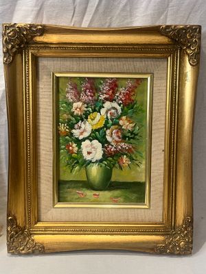 painting of a vase of flowers in a gold frame on a white background