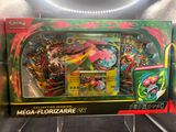 the box contains a collection of pokemon cards, including a mega - florizarre