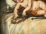 a painting of a baby laying on a bed with a crown of thorns