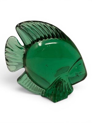 green glass fish shaped dish on a white background