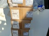 boxes stacked on top of each other in a pile on top of a table