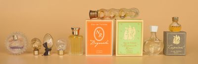 a lot of perfume bottles sitting on a table