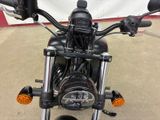 a close up of a motorcycle parked in a garage