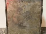 antique silver plated picture frame with a red light in the middle