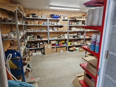 a room filled with lots of boxes and shelves