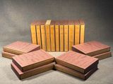 several books are stacked on top of each other on a table