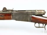 an old gun with a wooden barrel and a metal handle