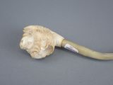 a picture of a pipe with a lion head on it