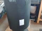 a black trash can sitting on a pallet in a warehouse