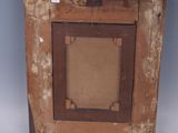 an old wooden picture frame with a picture hanging on a wall