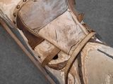 an old skateboard with a leather cover on it