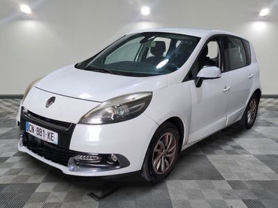 a picture of a white car parked on a checkered floor