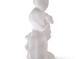 a white figurine of a woman holding a baby
