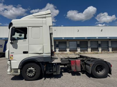 a white truck that is parked in front of a building
