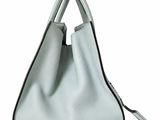 a white purse with a zipper on the top and a black handle