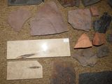 several pieces of rock and stone are arranged on the floor
