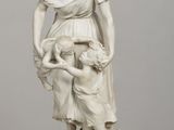 statue of a woman holding a child in her arms