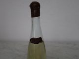 a bottle of wine that has a brown label on it