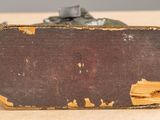 a piece of wood with a rusted surface on it