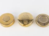 three different types of brass knobs on a white surface