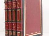 a set of five red books sitting on top of each other