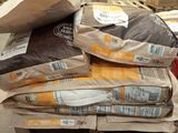 many bags of food sitting on a pallet in a warehouse