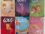 plusieurs livres pour enfants sont alignés sur une surface blanche
