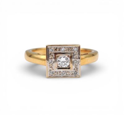 a yellow gold ring with a square shaped diamond surrounded by small diamonds