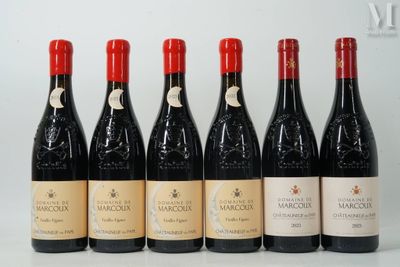 six bottles of wine are lined up on a table