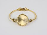 an image of a gold watch with a chain around it