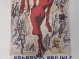 une affiche représentant une femme en robe rouge accrochée au mur