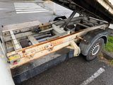 a truck that has a flat bed on the back of it