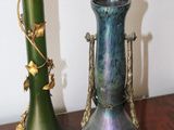 two vases that are sitting on a table