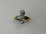 an image of a gold and silver ring on a white surface