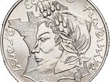 gros plan d'une pièce de monnaie sur laquelle figure un visage de femme