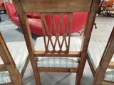 two chairs that are sitting next to each other