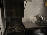 a small kitchen with a sink and a stove in it