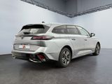 the rear end of a white toyota mira hybrid parked in a garage