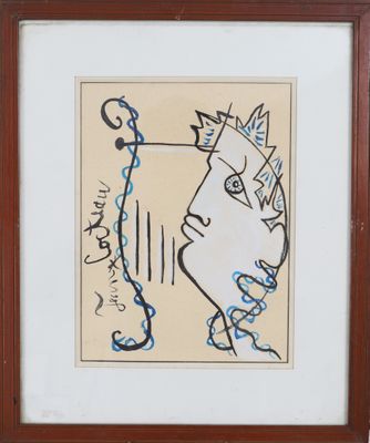 framed picture of a drawing of a man ' s face on a piece of paper