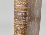 an old book sitting on top of a wooden table
