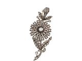 an antique diamond flower broochle