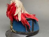 a hat with a feather on top of it