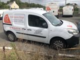a white van that is parked in a parking lot