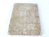 a book that is sitting on a white surface