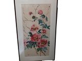 tableau encadré représentant des fleurs et des feuilles sur fond blanc