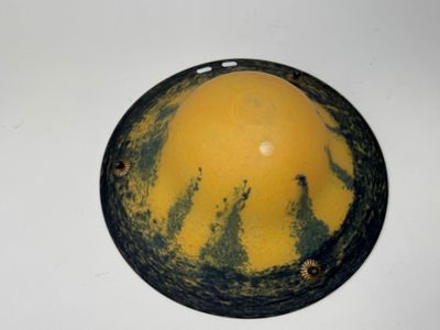 a yellow and black helmet sitting on a white table