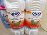 two bottles of onyx biotech on a counter next to a bottle of deodorant