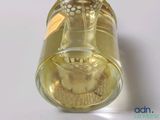 a bottle of liquid with a picture of a cat inside of it