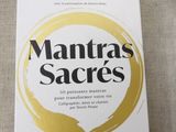 the book mantras sacreds is sitting on a table