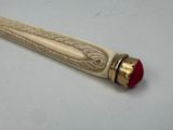 a pen that is sitting on a white table